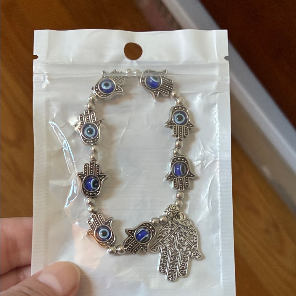 Silver Hamsa Bracelet with Blue and Silver Accents